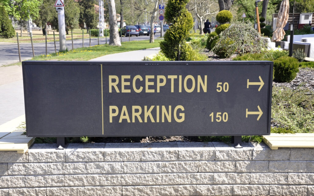 reception and parking sign