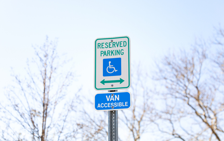 The handicap sign is a blue and white symbol of accessibility. It represents the need for barrier-free access for individuals with disabilities, ensuring their equal participation in society.