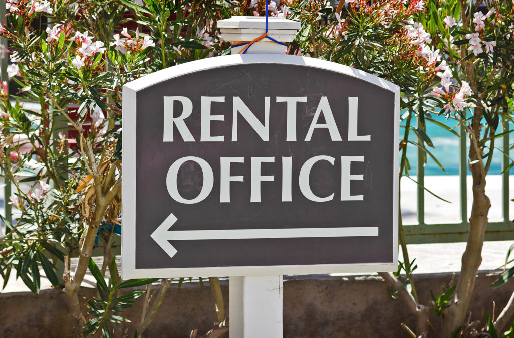 Rental,Sign,Shows,Direction,Where,The,Office,Is,Located,At.