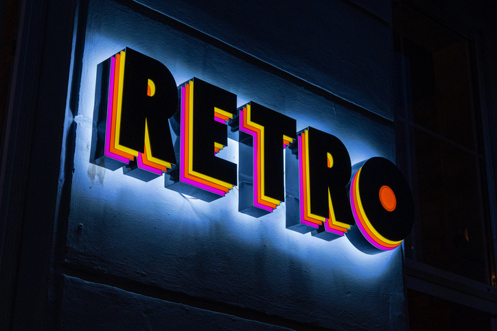Retro vintage sign with words Retro on it, with typical yellow, orange and violet color. Funky vintage writing of word retro.