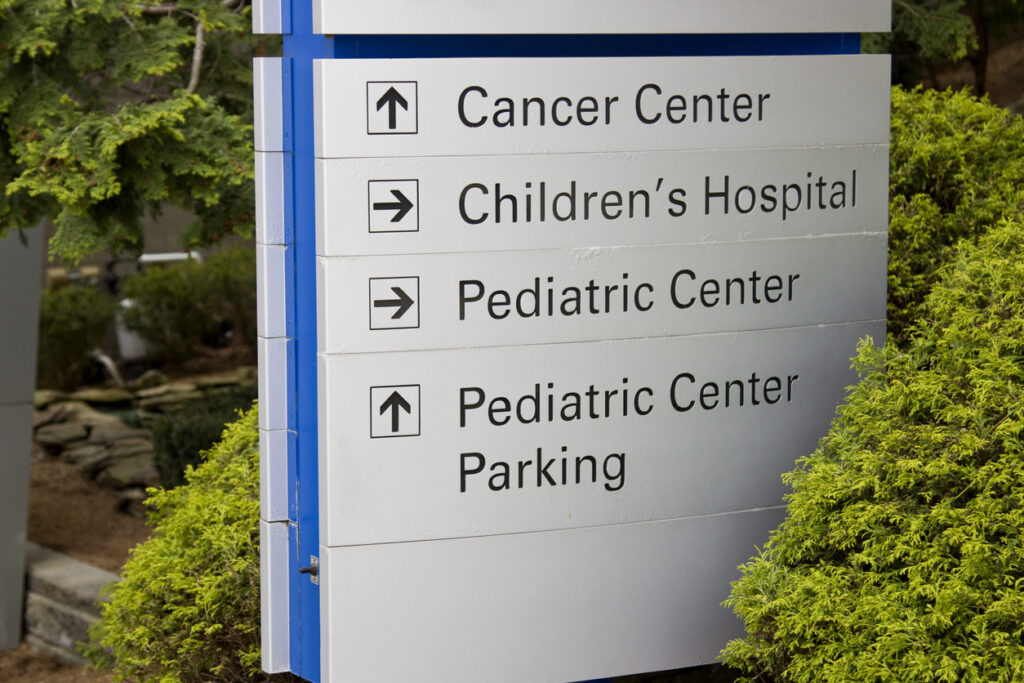 Hospital Emergency sign with directions to other facilities