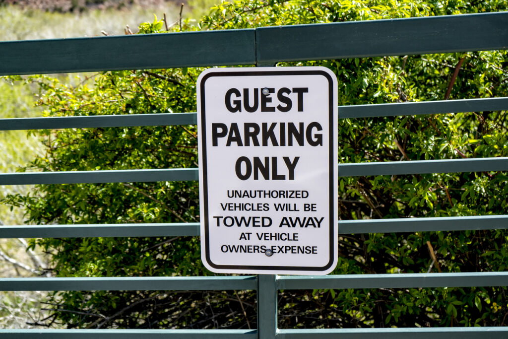 Guest parking only warning sign