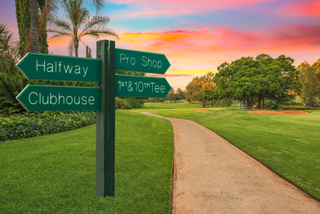 Golf,Course,Direction,Sign,And,Pathway,Next,To,The,Fairway