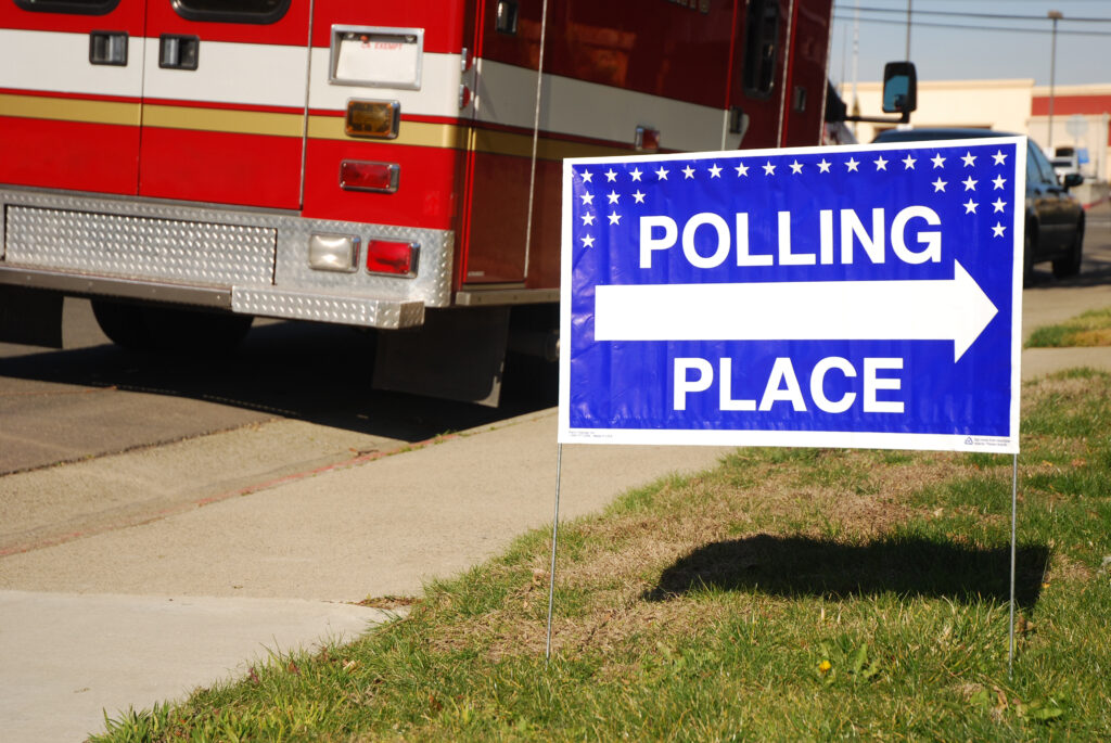 Polling,Place,Sign,Outside,Of,A,Fire,Station