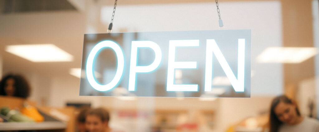 Open Sign Hanging in Store Window